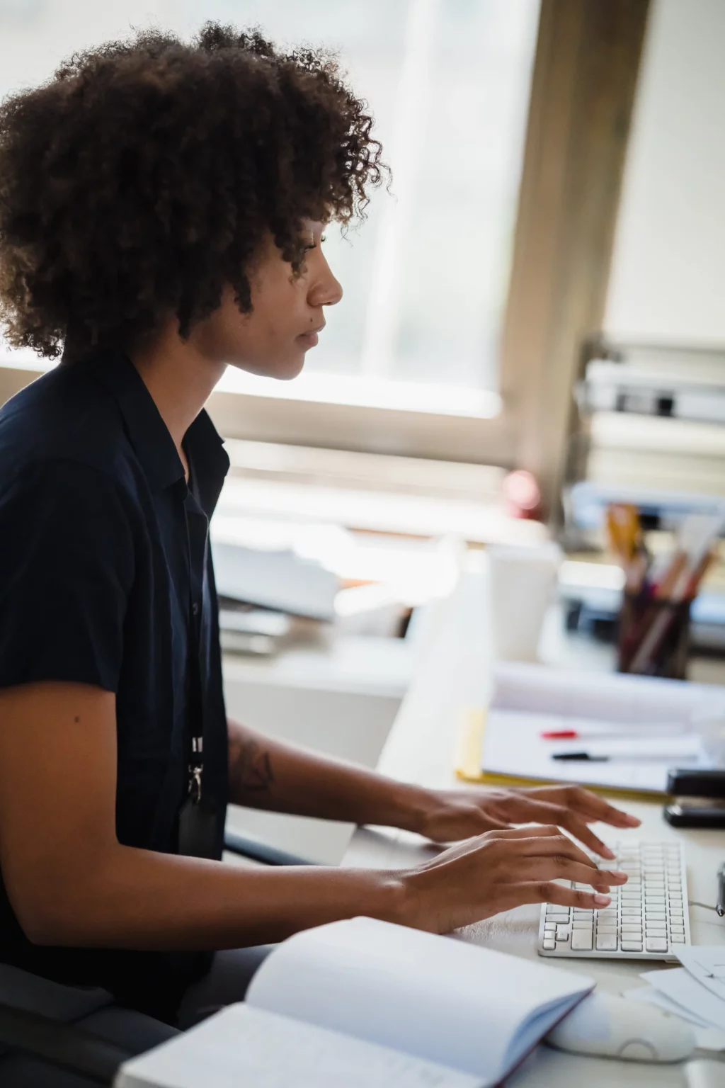 A VibTech team member working at a desk